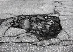 A Highland councillor has ht out at the way potholes are repaired