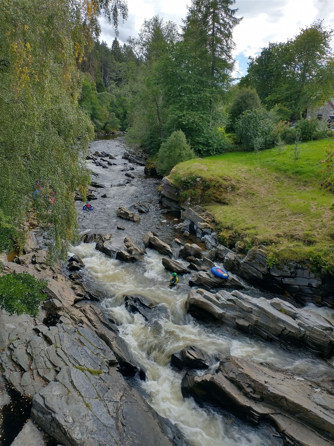 Pausing to watch some river tubing.