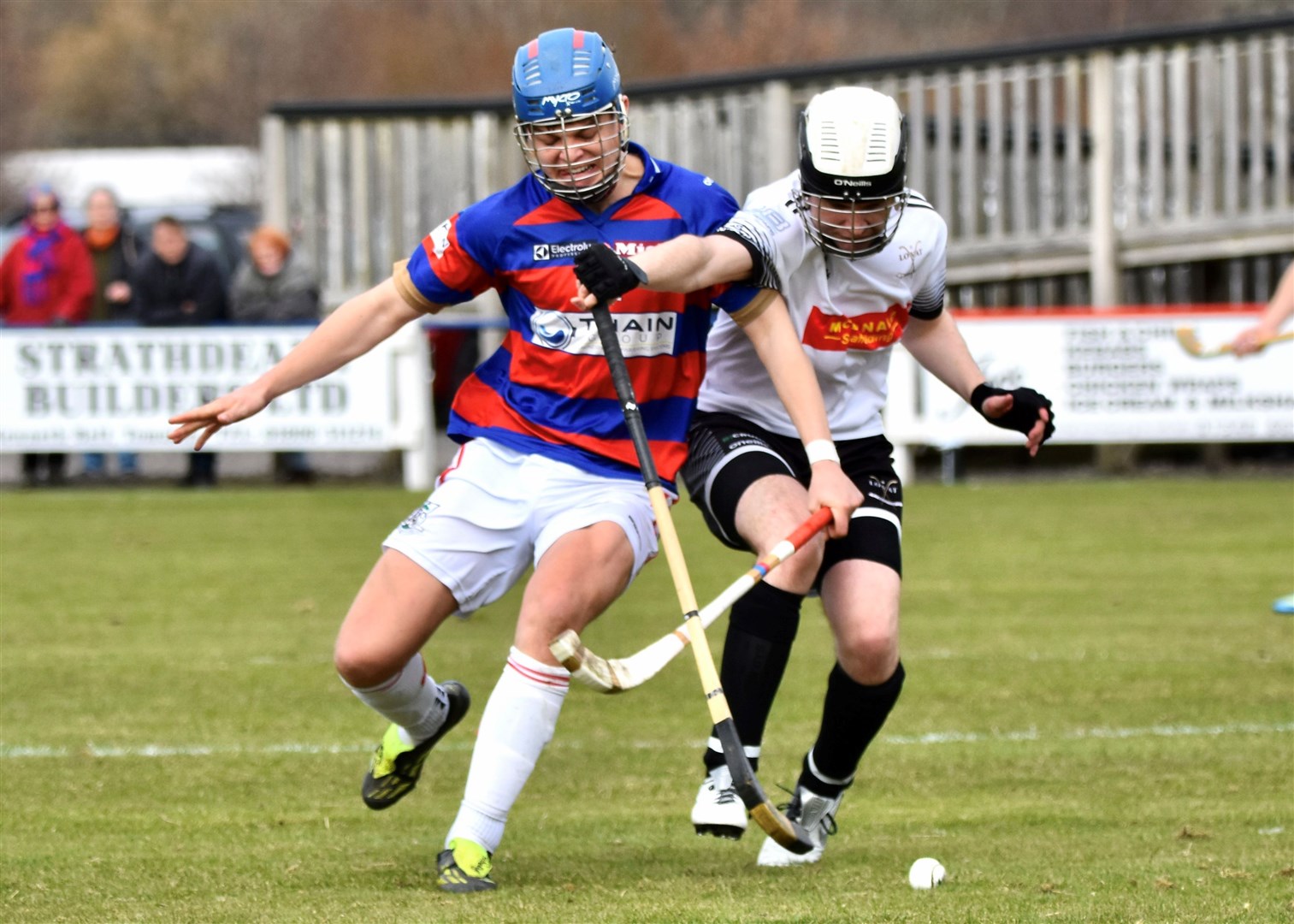 Iain Fraser gets to the ball first for Kingussie. Picture: Fiona Young.