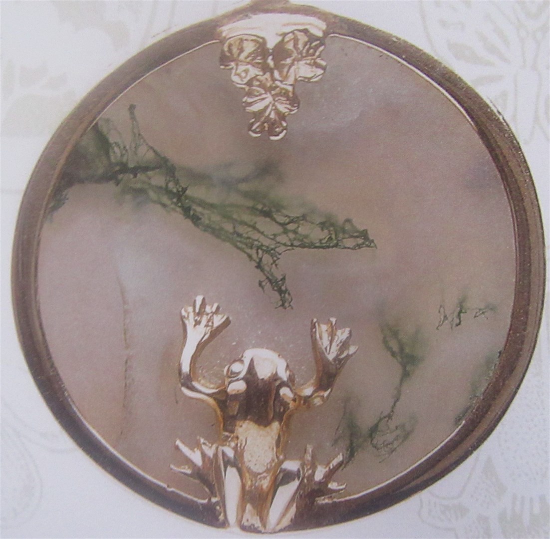 A beautifully created pool pendant made from moss agate