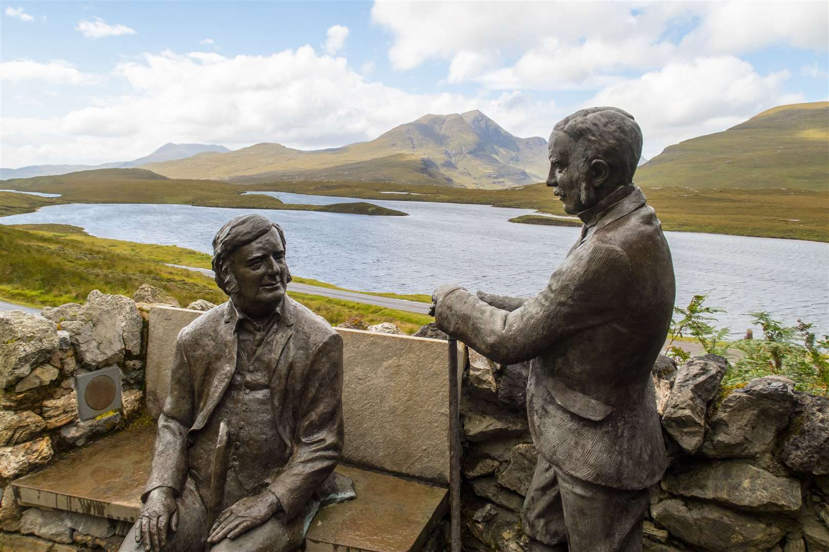 Statues of the geologists Benjamin Peach and John Horne at hiking trail at Knockan Crag in North West Highlands Geopark, Scotland.
