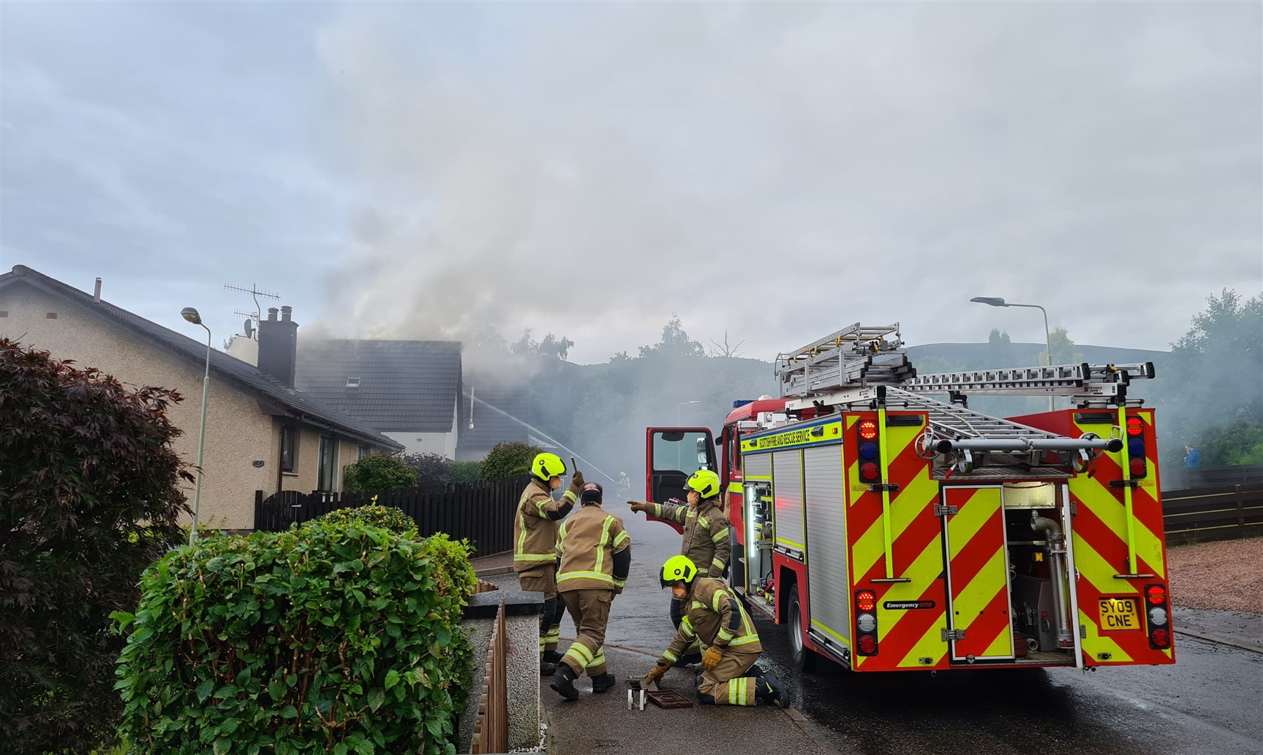 Firefighters at the scene of the housefire in Aviemore.