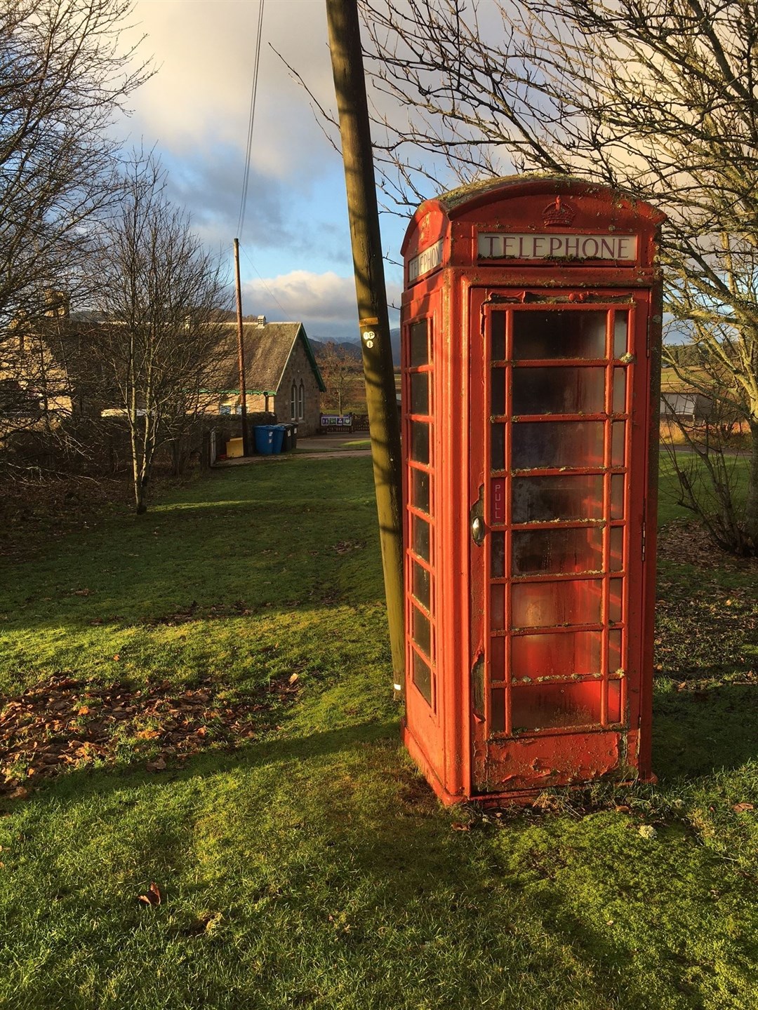 The red phone box in Laggan next to the village's primary school.