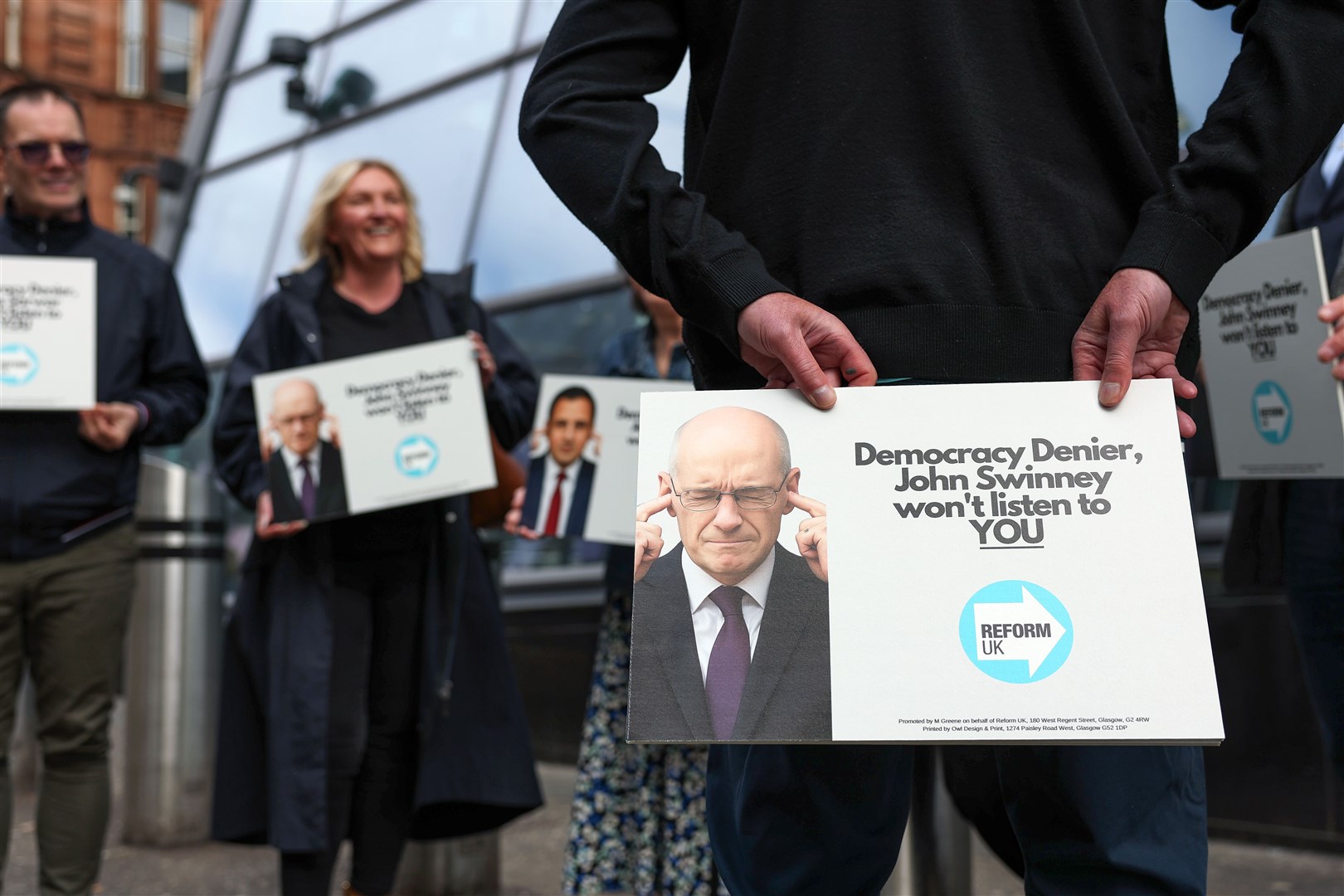 Protesters outside the Glasgow summit branded the Scottish First Minister a ‘democracy denier’ (Jeff J Mitchell/PA)
