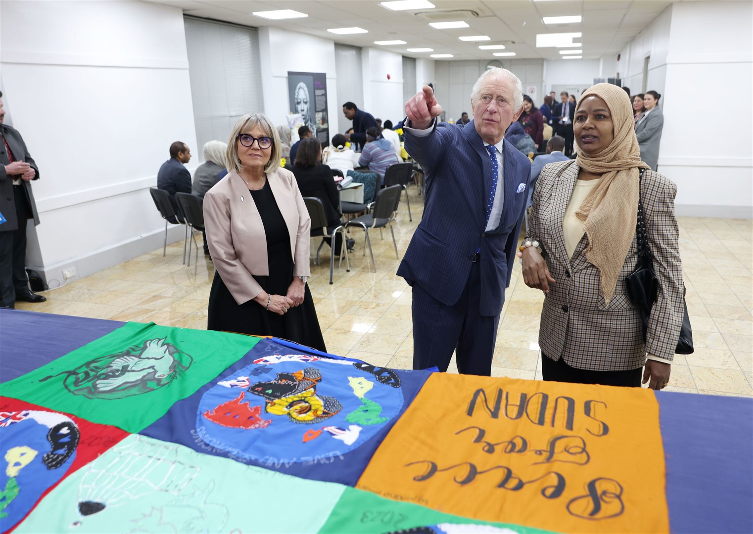 Charles chatted with accountants, NHS consultants and charity workers who have made a new life for themselves in the UK, (Ian Vogler/Daily Mirror/PA)