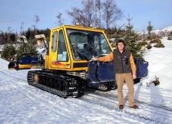 Mr Bill Wilson with the Bombardier piste machine