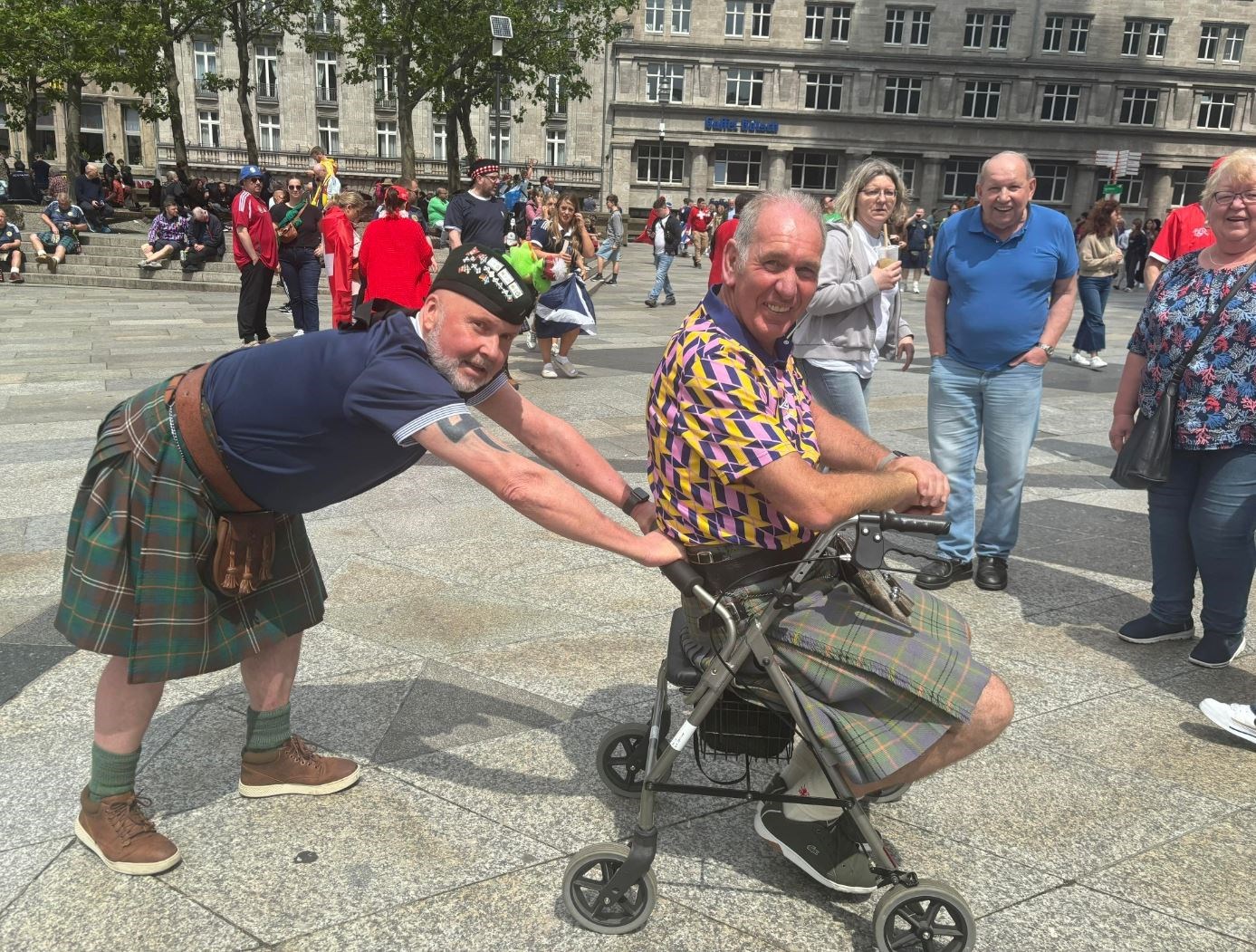 Ross County fan Duncan Chisholm and passenger caper in Cologne.