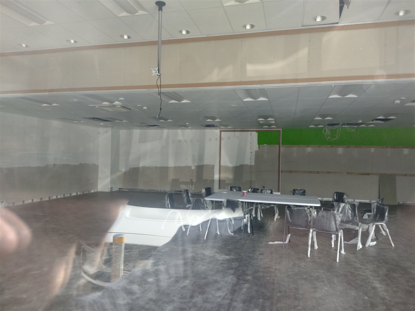NOTHING DOING: Inside the building, just empty chairs and one table.