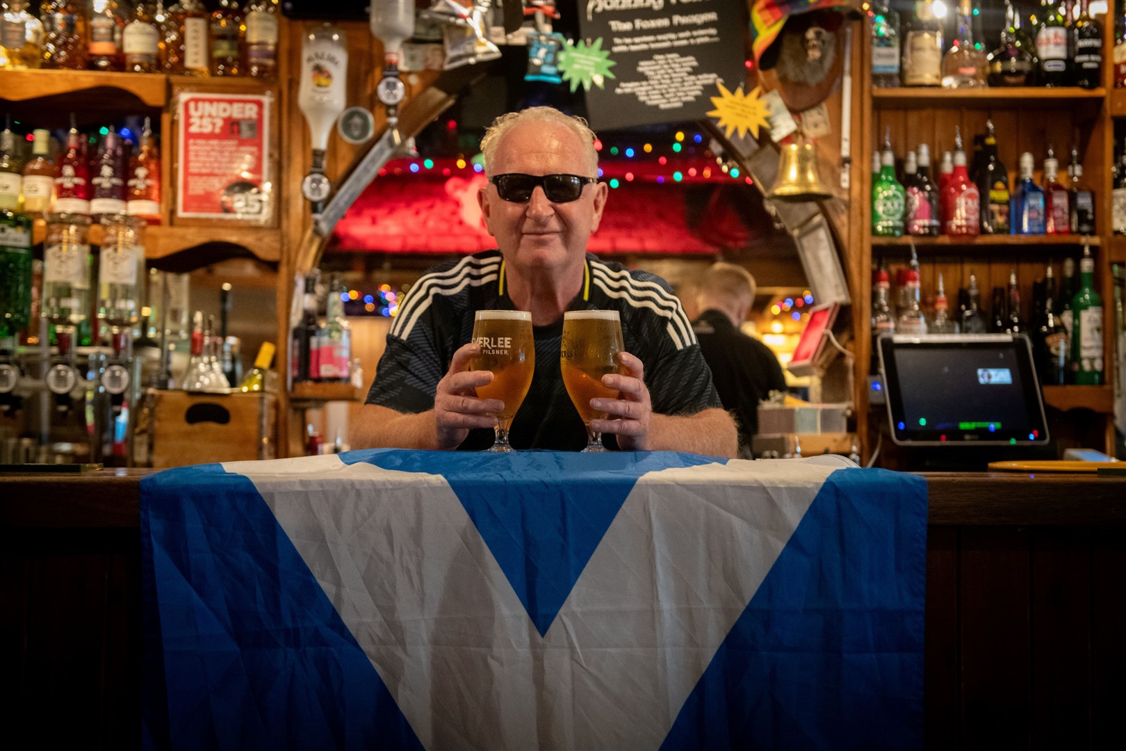 Don Lawson behind the bar at Johnny Foxes in Inverness. Picture: Callum Mackay.