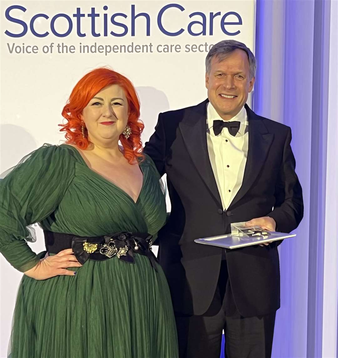 NIGHT TO REMEMBER: Pop star Michelle McManus presents Mr Taylor with his award at the Glasgow Hilton Hotel last Friday.