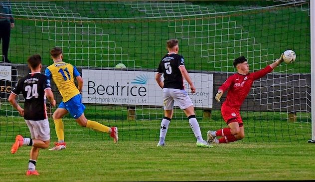 Wick keeper Lewis Gallacher scrambles to get a goalbound header from the Jags' Lewis Mackie past the post. Picture: Mel Rogers.