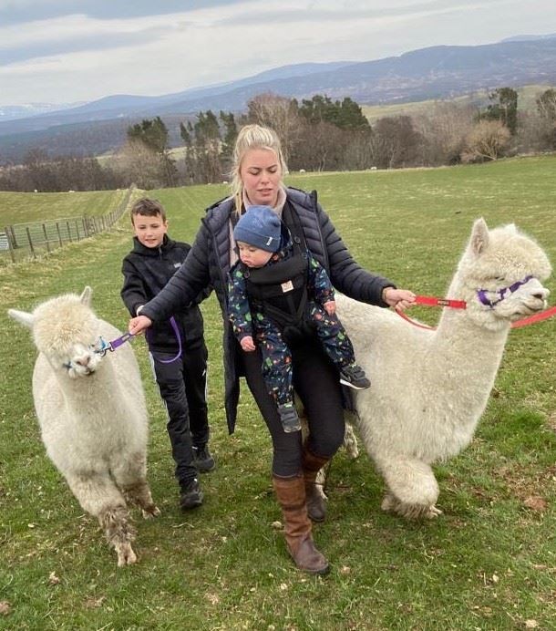 Jenni MacDonell steps out on Badenoch and Strathspey’s first alpaca trek, with baby son Donald and cousin Jaiden McCormack.