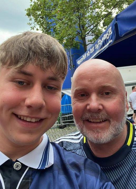 Duncan (right) and son Struan Chisholm are in Germany 50 years after their dad and Grandad attended the 1974 World Cup there.