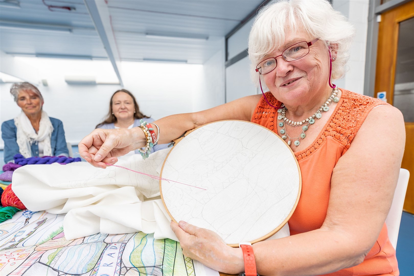 The first stitch, Avernon Centre, Alness. Stitcher Norma Bain, is pictured with Julie Coghill and Anne Thackray.