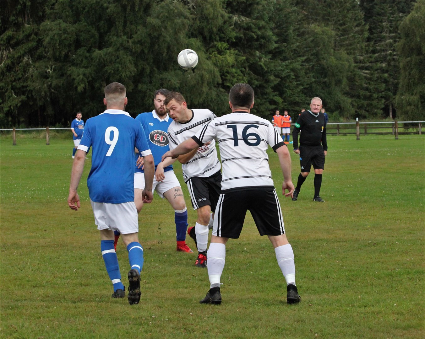 Boat’s Connor Macleod gets in ahead of Grantown’s Joe Hopkins (left) and Martin Little.