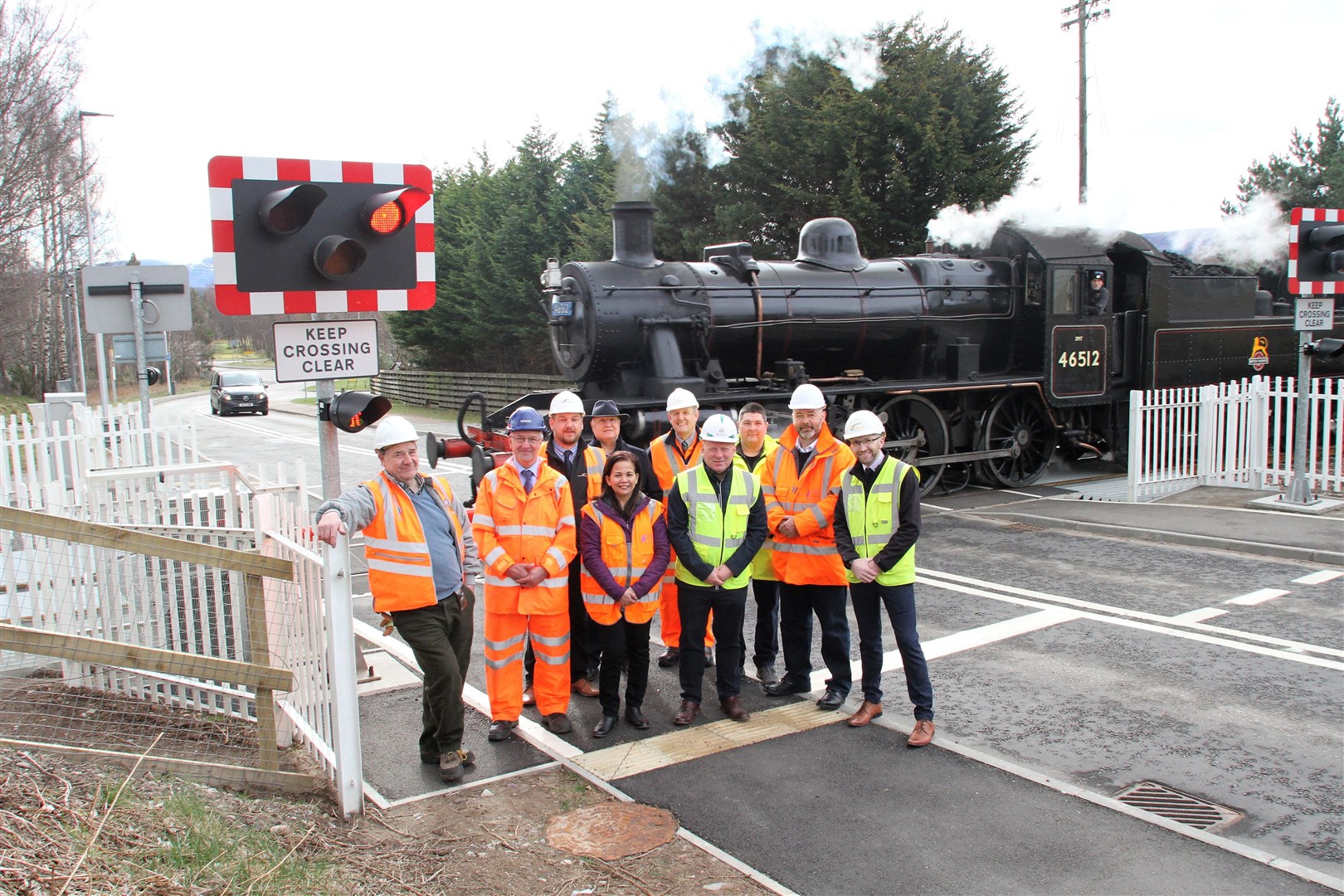 Getting across at Aviemore: from left, Colin Stirling, Vice Chairman, Strathspey Railway; John Lowe, LC Consultant (Designer), SYSTRA, York; Kris Brown, Contract Manager, WMDonald; Highland Council Convener and Area Committee Member for Badenoch and Strathspey, Cllr Bill Lobban; Anna Liza Groat, Engineer, Highland Council; Stephen Muirhead, Dalfaber LC Project Engineer SR; Les Crawford, Project Manager, Scotia Homes; John Allan, Lighting & Communications Manager, Highland Council; Richard Porteous, Roads Operations Manager South, Highland Council; Scott Dickie, Technical Manager, WMDonald.