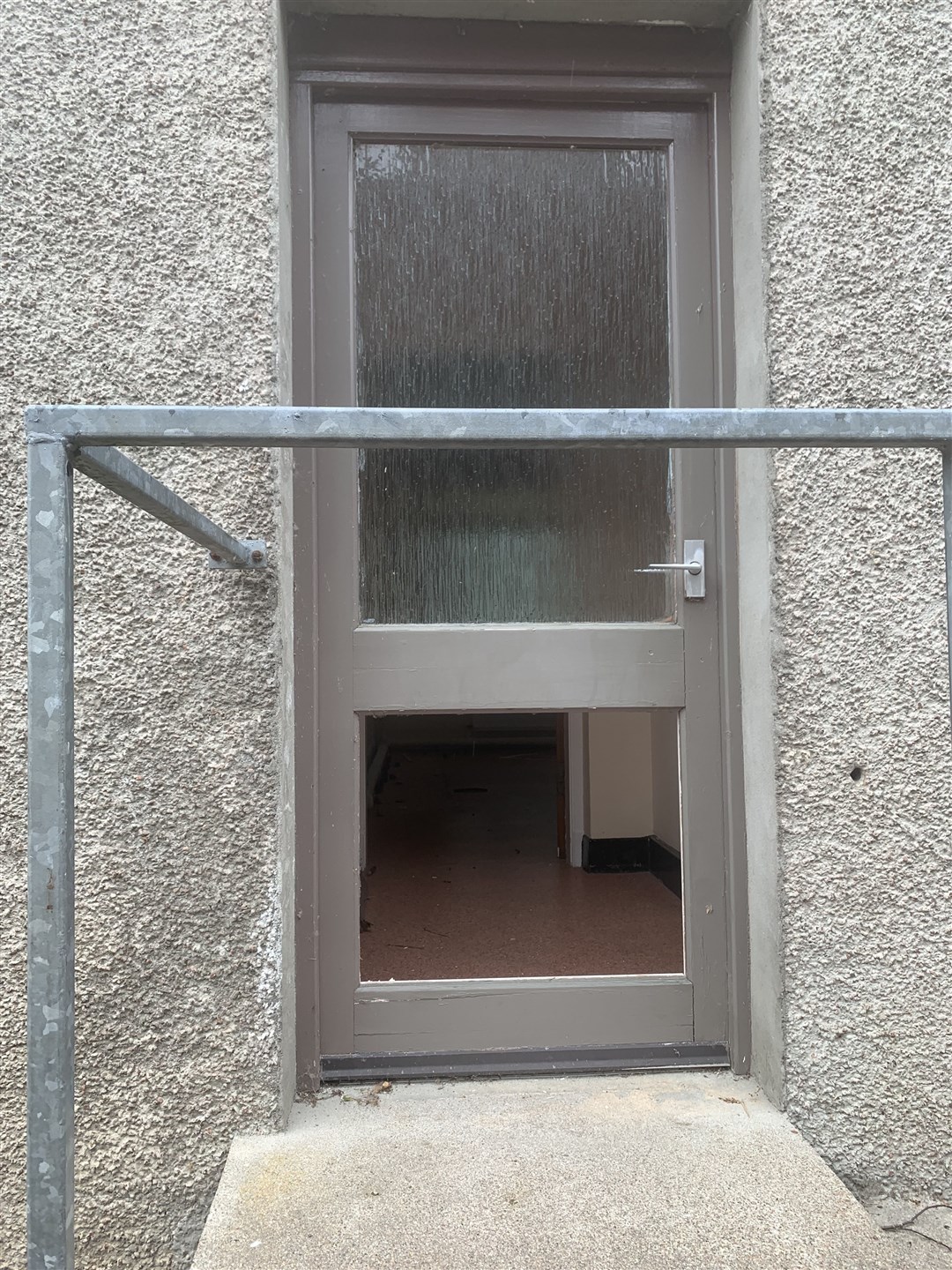 The lower pane of the back door has been removed