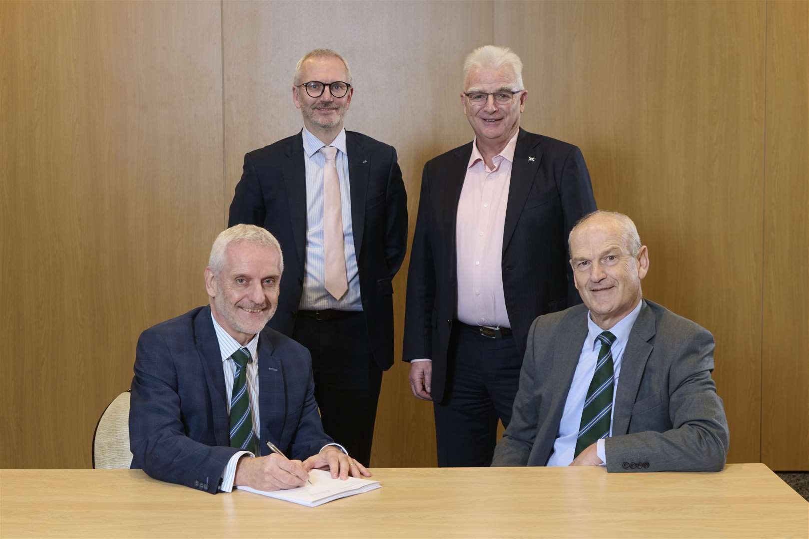 Signed, sealed and delivered... (left to right) Sandy Grant (Tulloch Homes Managing Director), Innes Smith (Springfield Chief Executive) , Sandy Adam (Springfield Chairman) and George Fraser (Tulloch Homes).