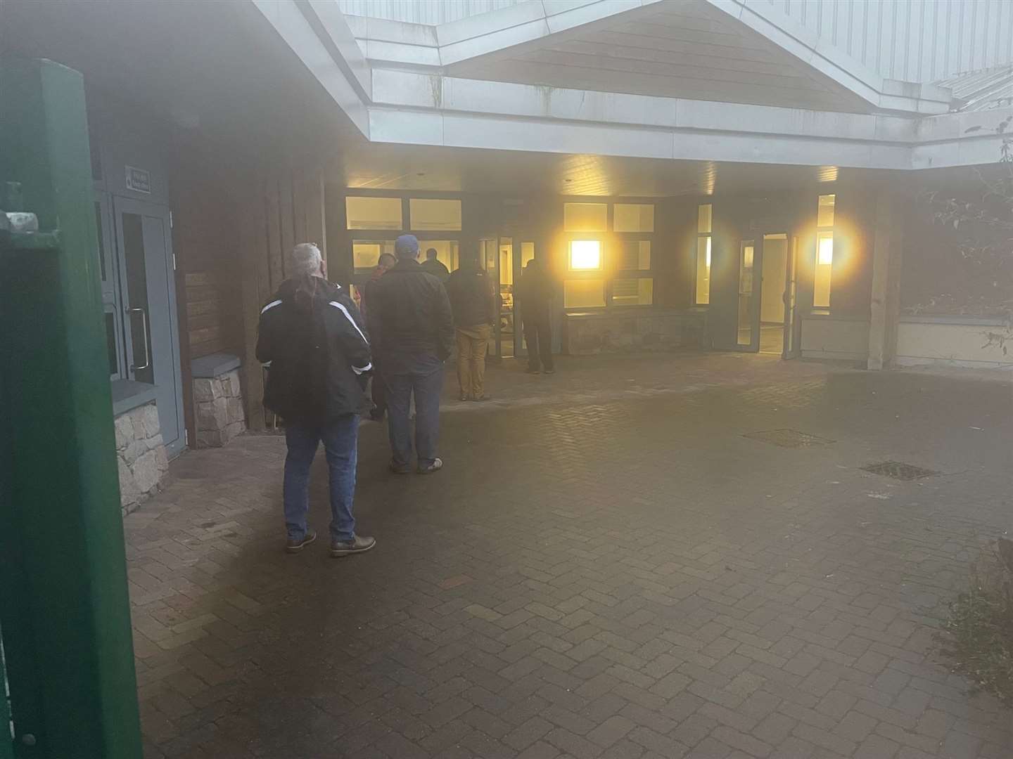 A short queue during a murky start to the day to get into the main hall where Covid boosters are being administered.