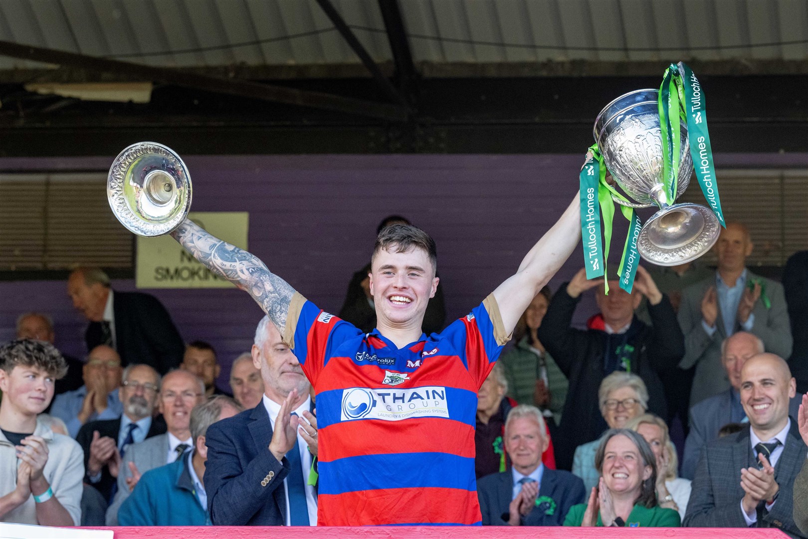 Kingussie captain James Falconer lifts the Camanachd Cup after the 1-0 win over Oban Camanachd in the 2023 Tulloch Homes Camanachd Cup Final played at The Bught, Inverness.