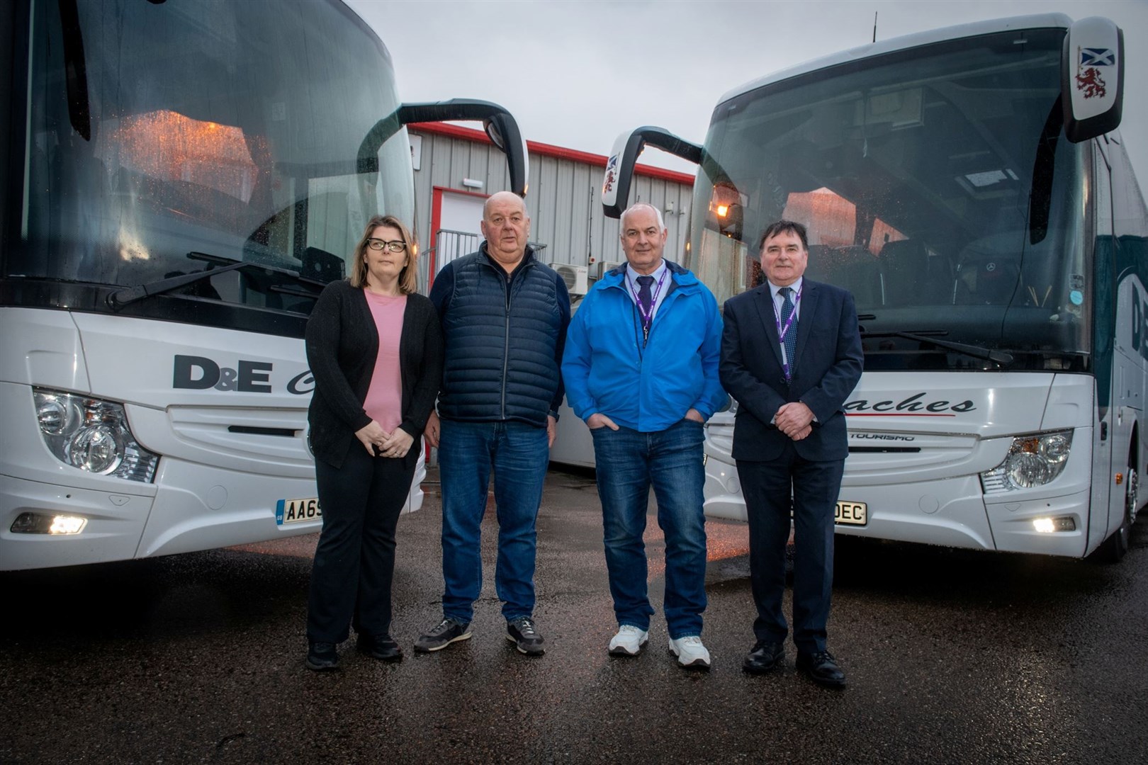 Plans to expand Highland Council-owned bus service after D&E Coaches buyout: pictured are the leader of the council Raymond Bremner (second from right) and the economy and infrastructure chairman Ken Gowans (far right). Picture: Callum Mackay.