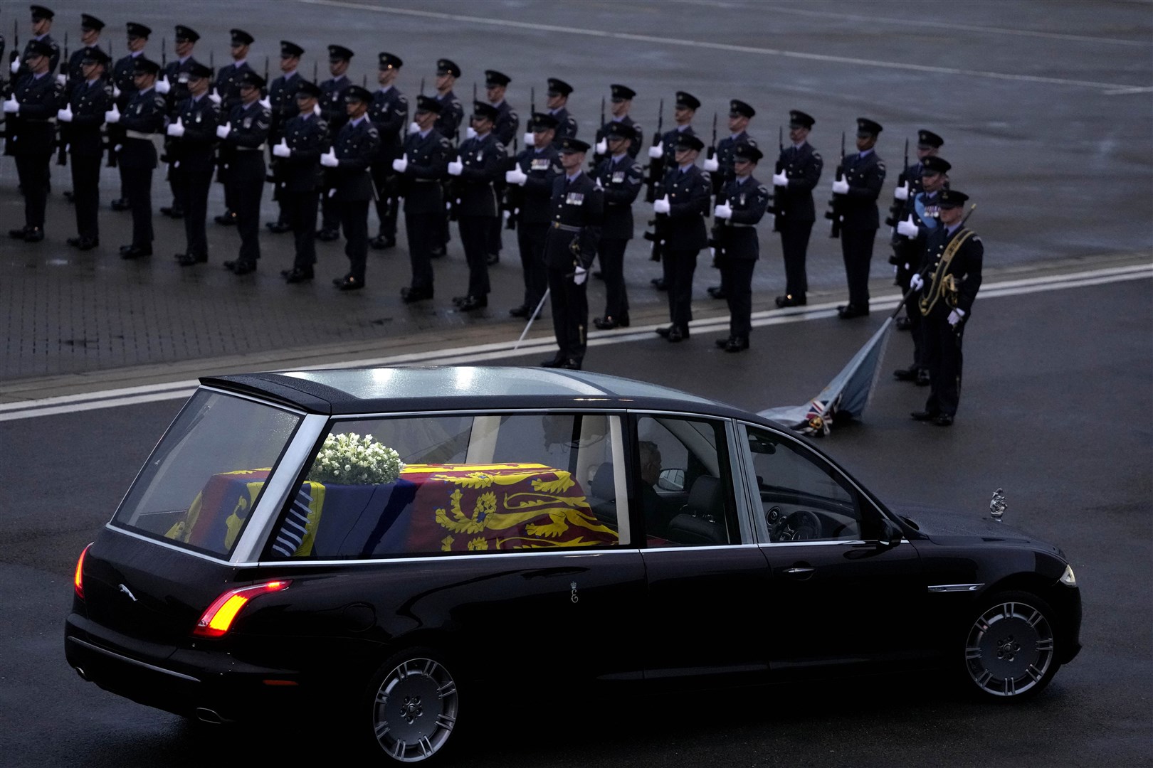 The coffin of Queen Elizabeth II carried in a State Hearse leaving RAF Northolt (Kirsty Wigglesworth/PA)