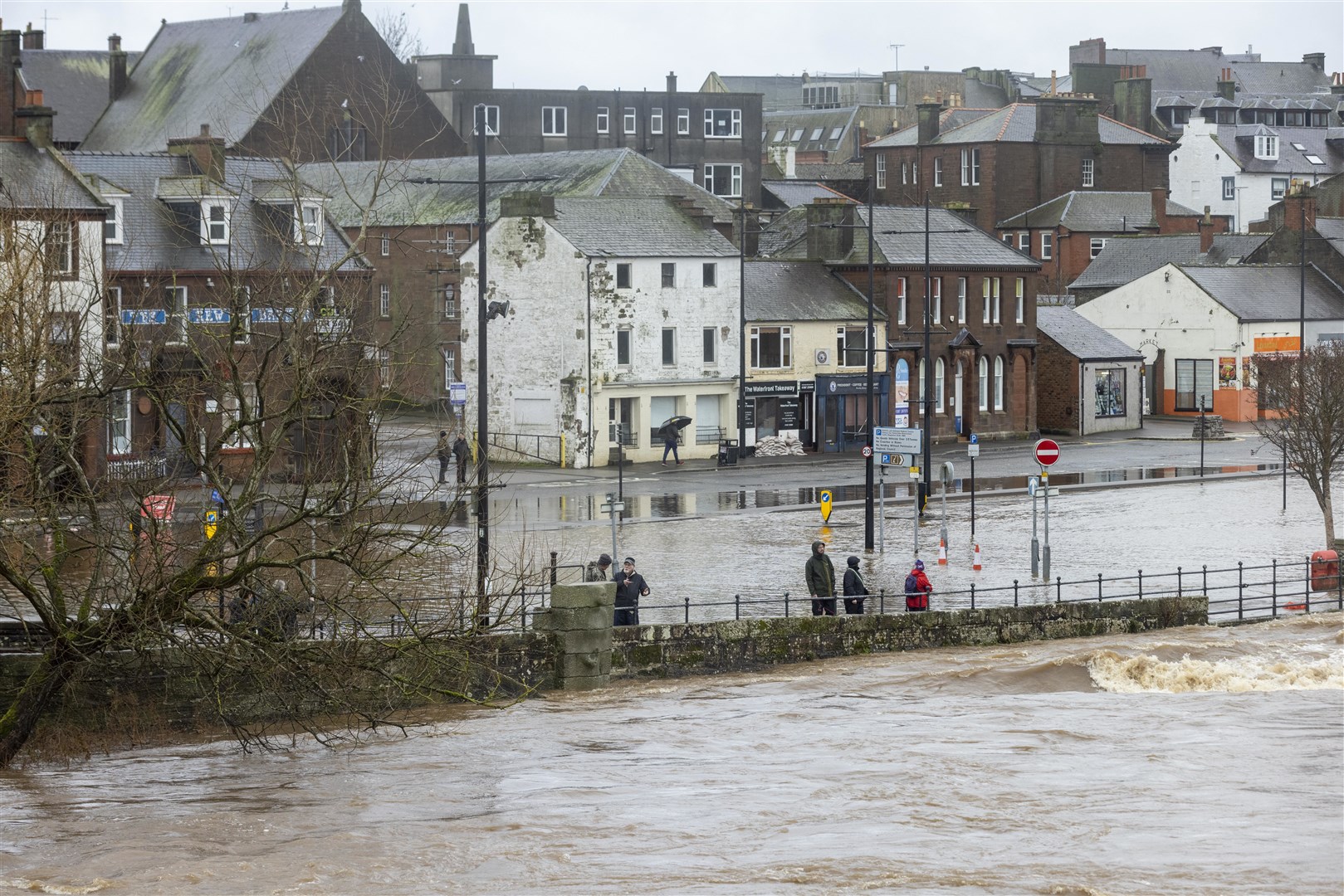 The River Nith burst it banks in Dumfries, flooding the nearby roads (Robert Perry/PA)