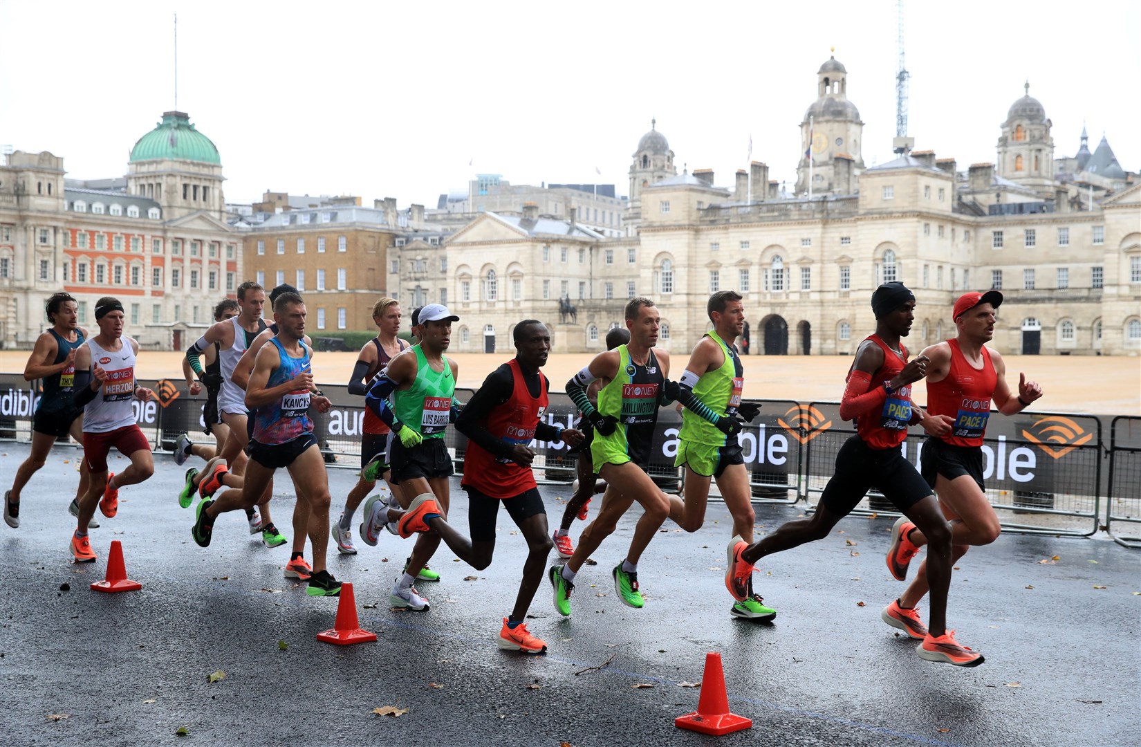 Athletes make their way past Horse Guards Parade (Adam Davy/PA)