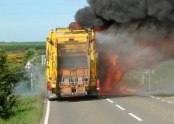 Thick black smoke bellows from the recycling truck after a fire broke out in the vehicle at Mey on Friday morning. Photo: Katrina Magee.
