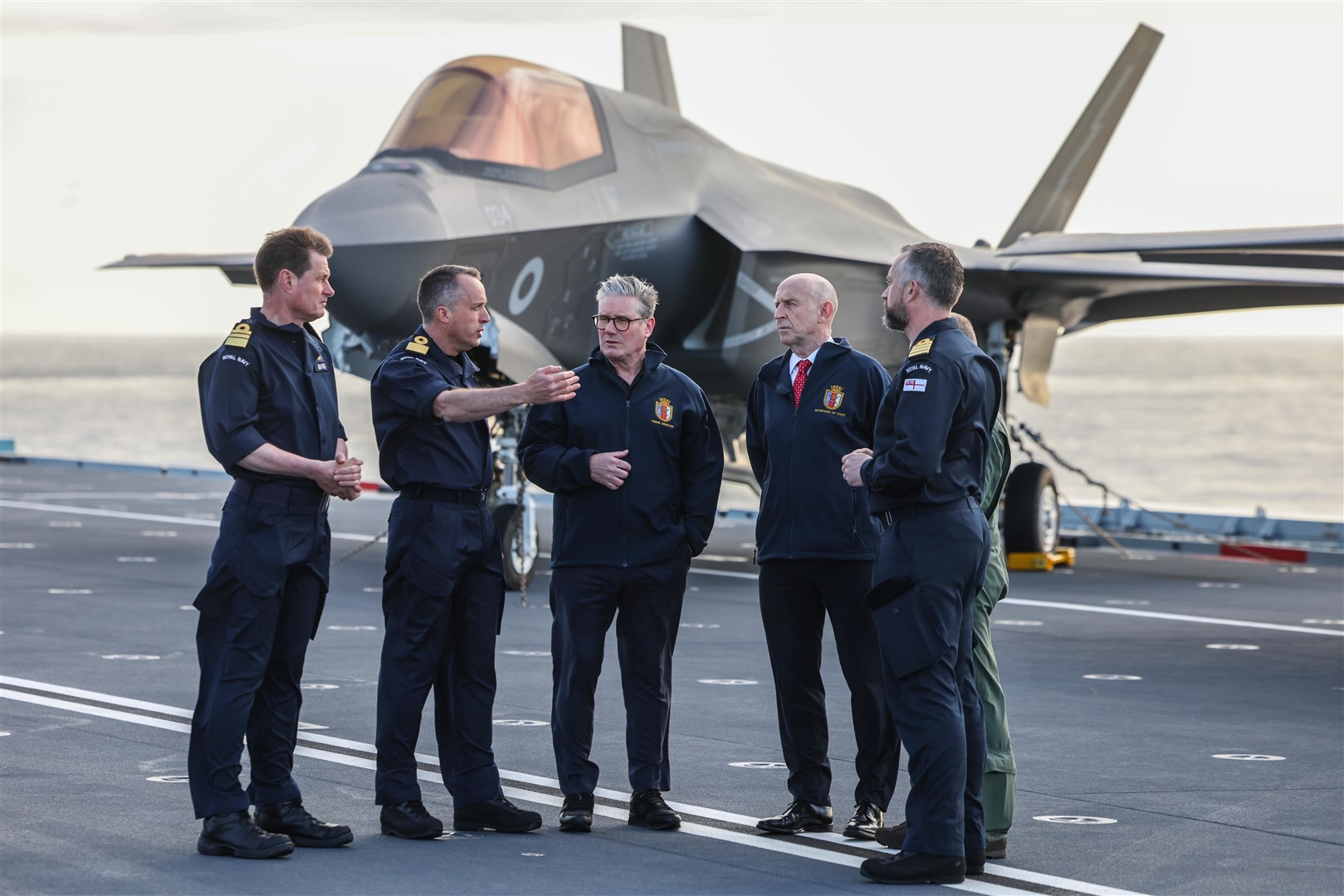 The Prime Minister and Defence Secretary John Healey are shown the flight deck of HMS Prince of Wales (Richard Pohle/PA)