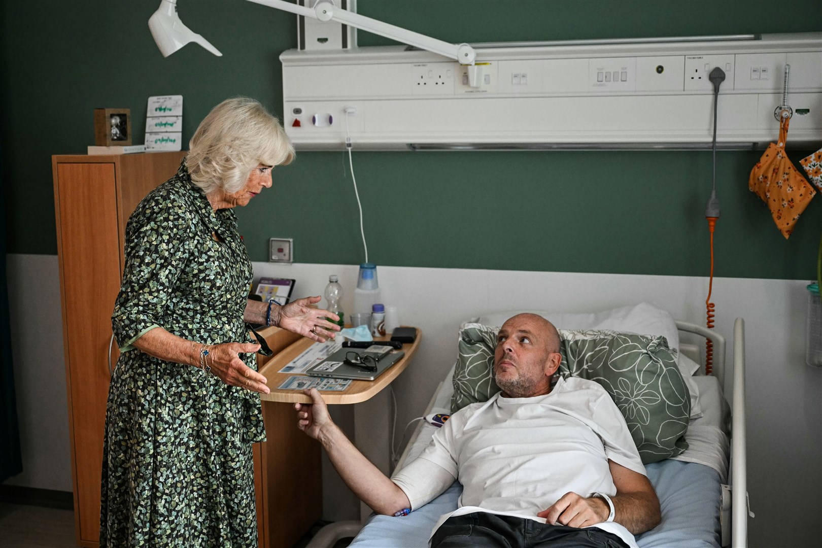 Camilla speaks to cancer patient Paul Holdway during her visit to the new centre (Justin Tallis/PA)
