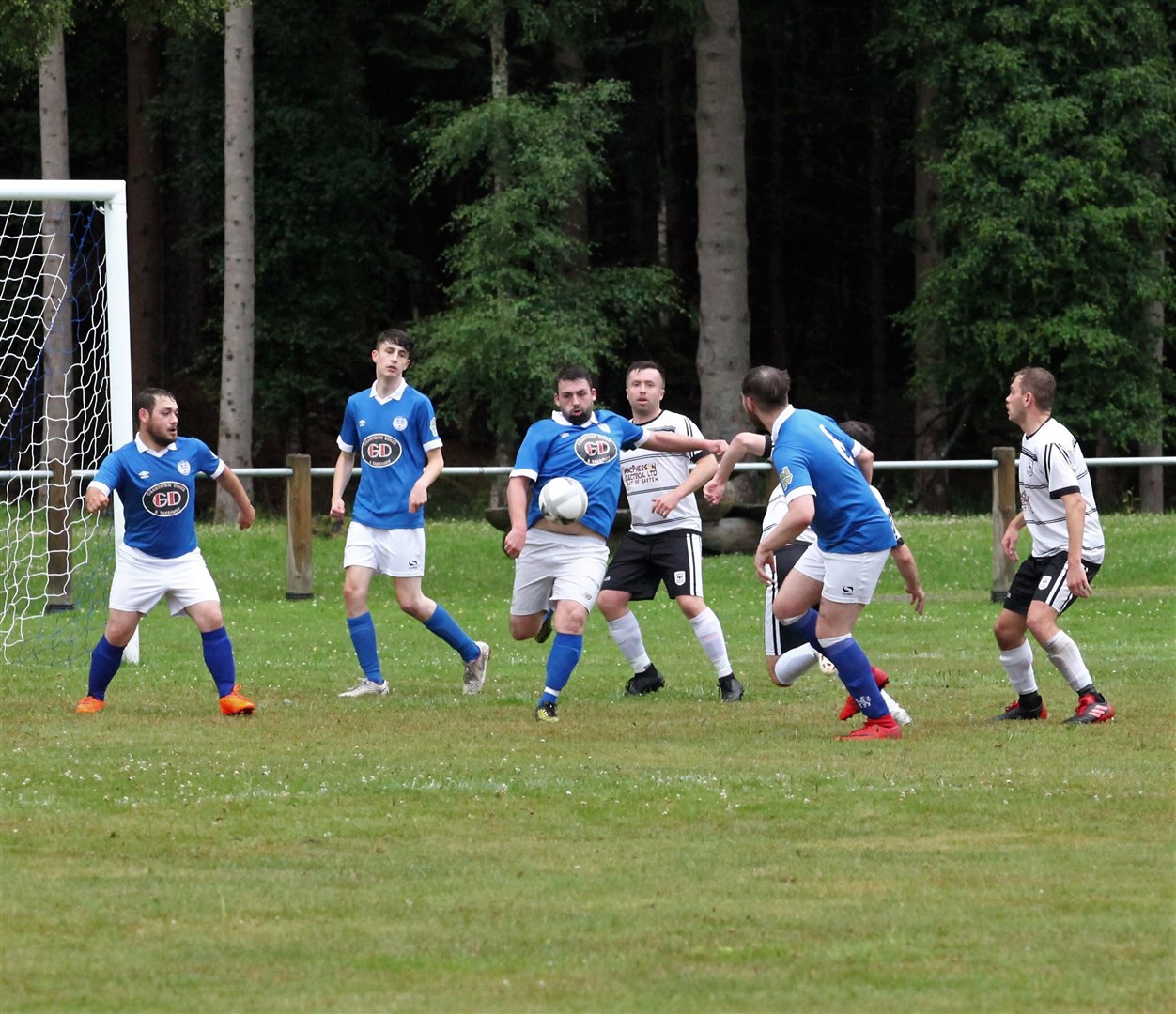 Shane Barclay hoofs the ball clear from the danger area for Grantown. Pictures: Frances Porter.